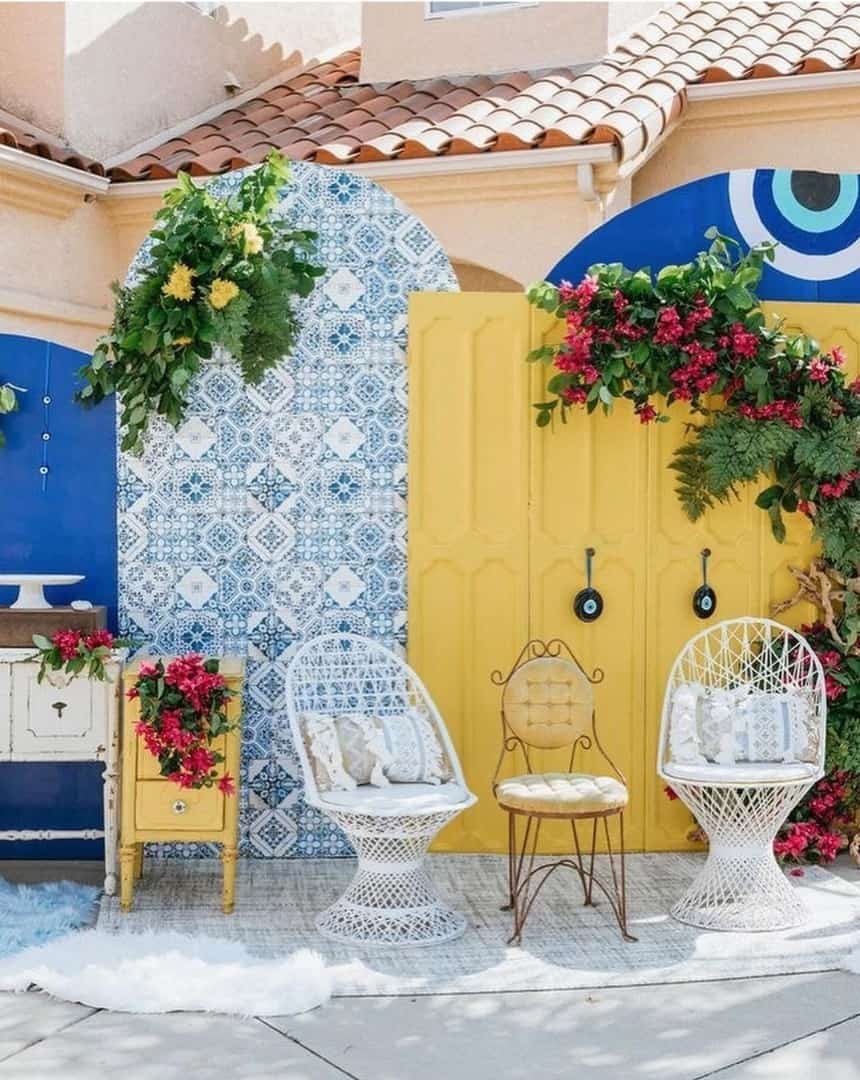 Birthday stage setup with chair and floral arch