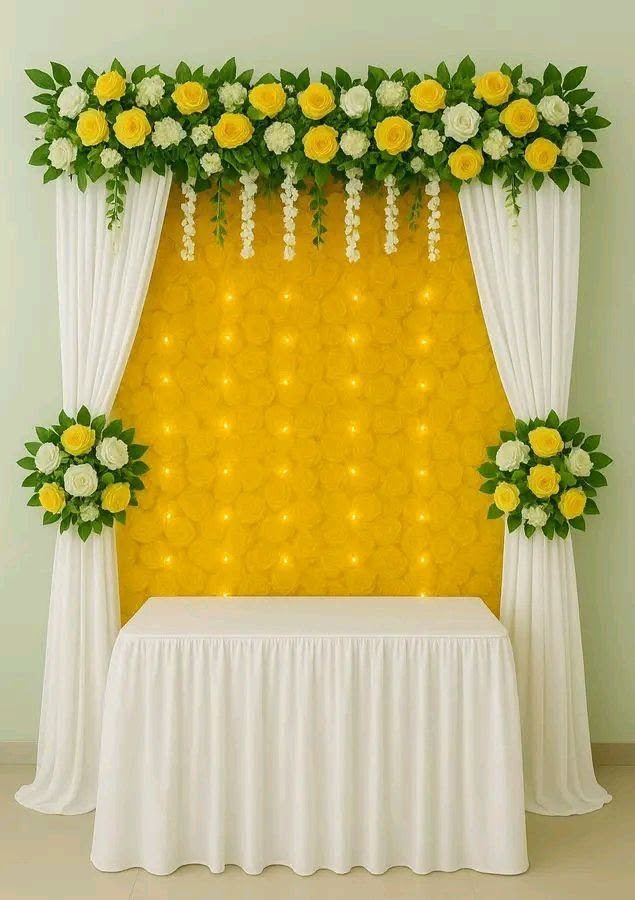 Traditional yellow ceremonial backdrop with floral decor