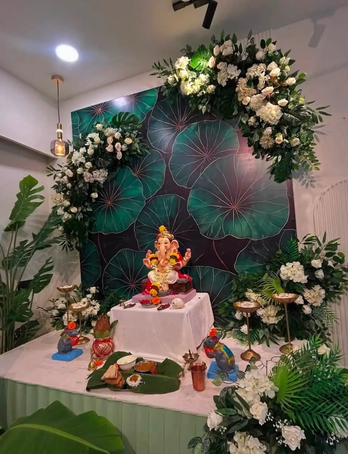 Ganesh ceremonial decor with floral backdrop