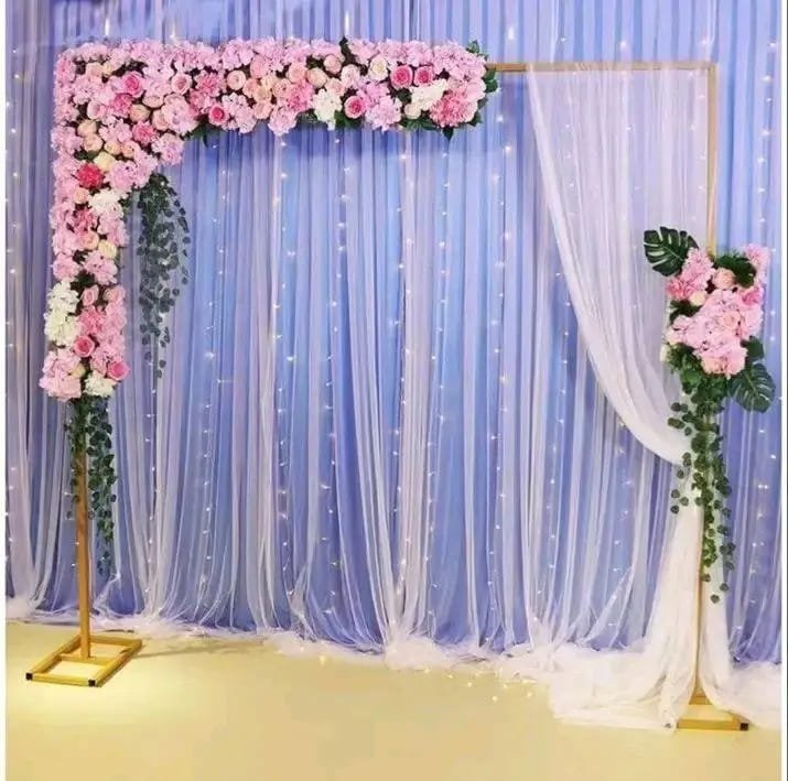 Blue and pink photo booth backdrop with floral details