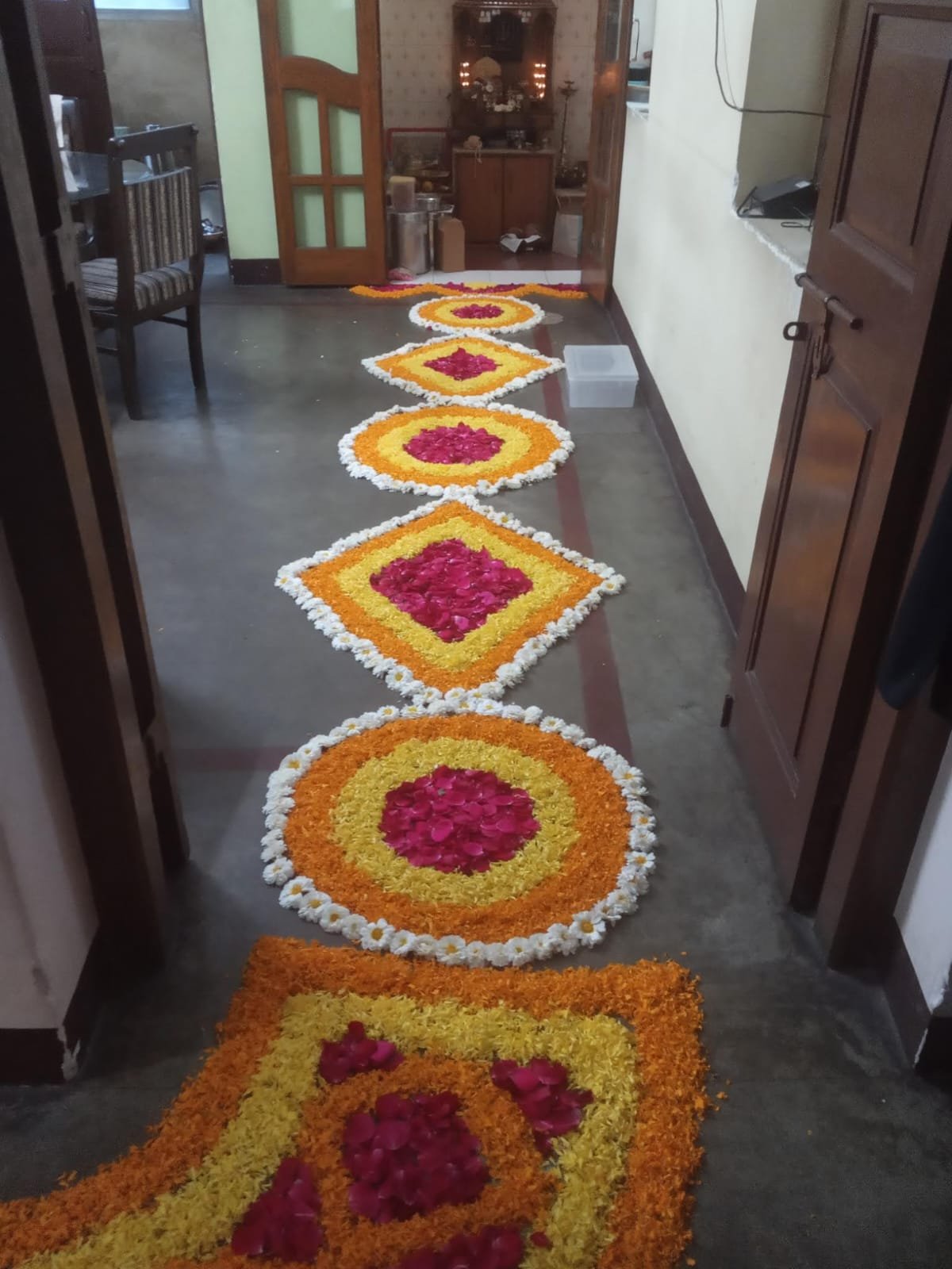 Decorative rangoli pathway for a home function
