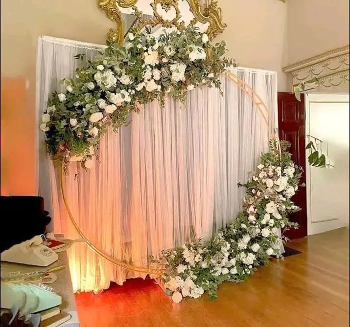 Floral wedding backdrop with drapes